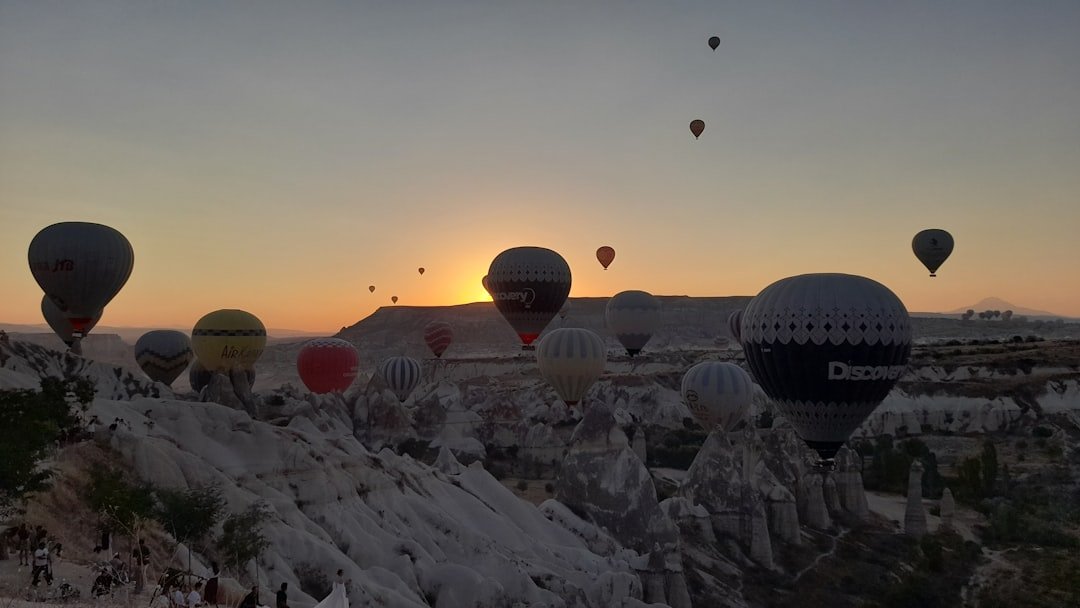 A group of hot air balloons flying in the sky